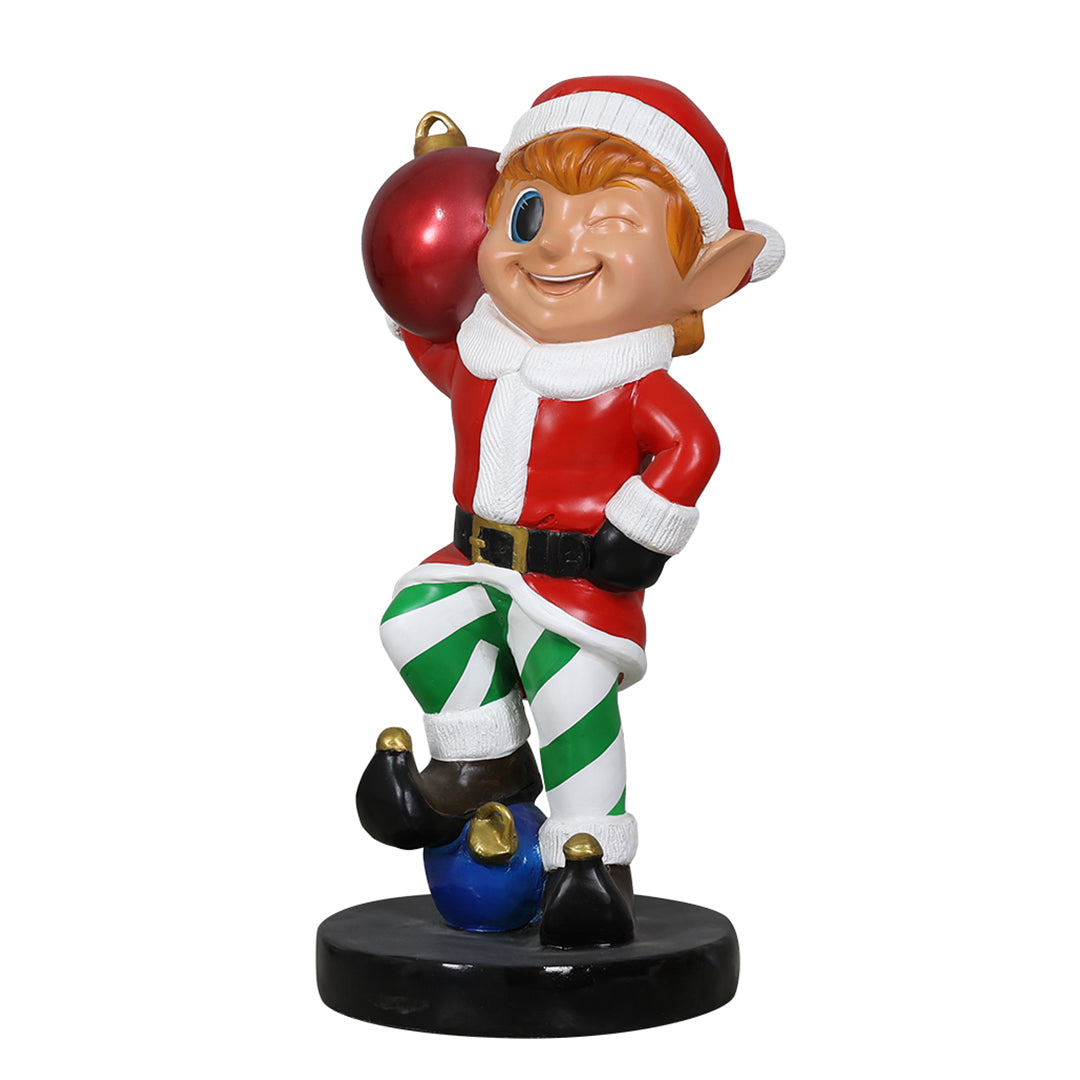 Elf holding ornament ball