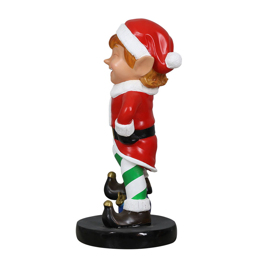 Elf holding ornament ball