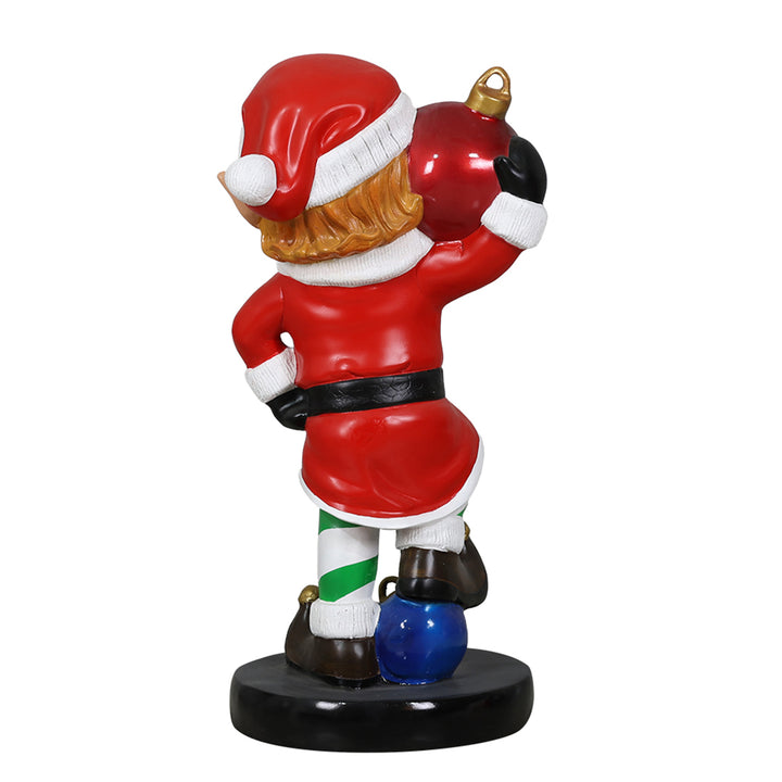 Elf holding ornament ball
