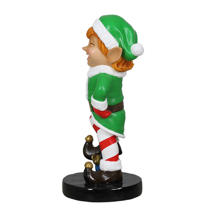 Elf holding ornament ball