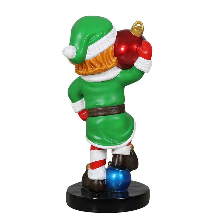Elf holding ornament ball