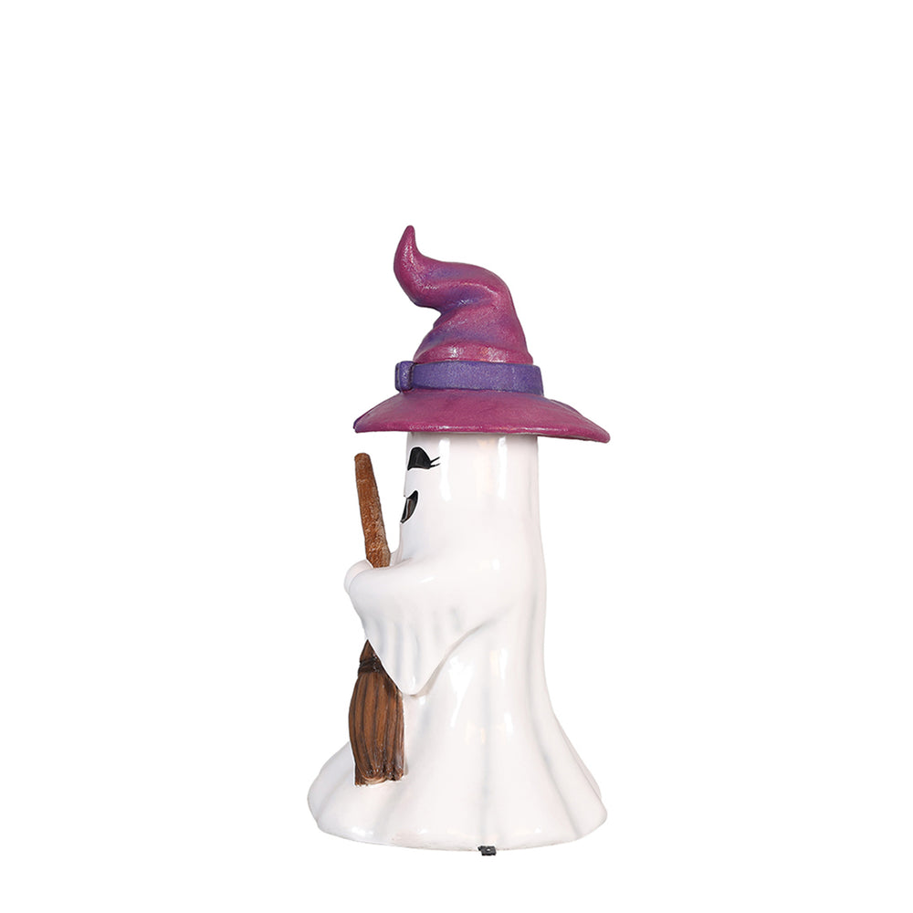 a ghost witch girl holding a broom side view