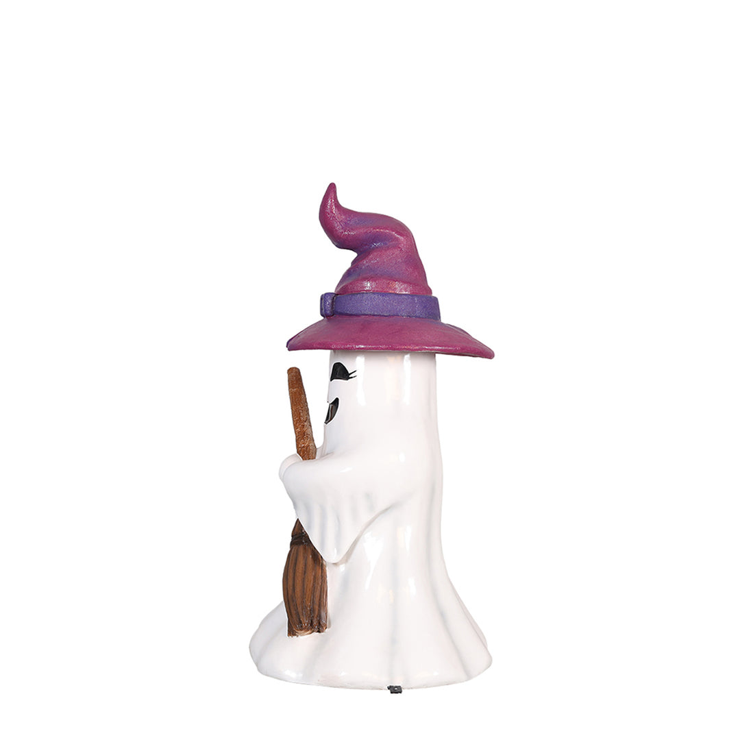 a ghost witch girl holding a broom side view