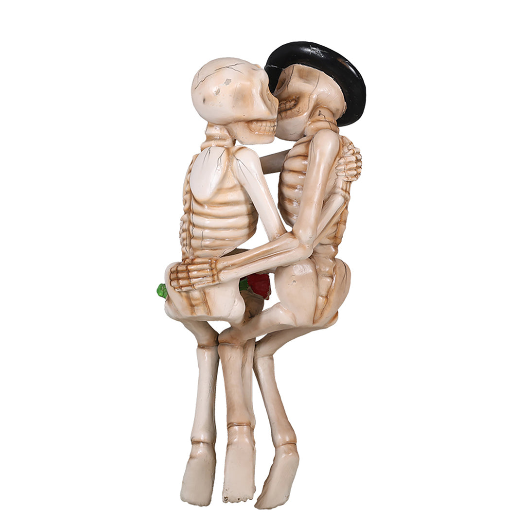two skeletons kissing on a bench back view