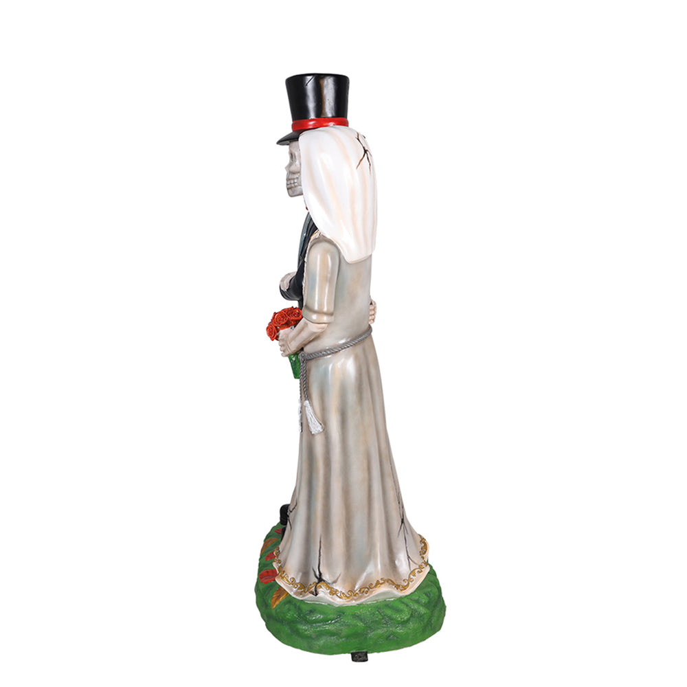 A married couple skeleton statue side view