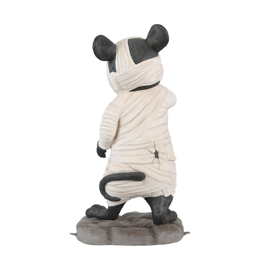 A mouse dressed as a mummy back view