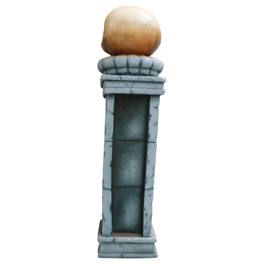 A skull pillar facing back